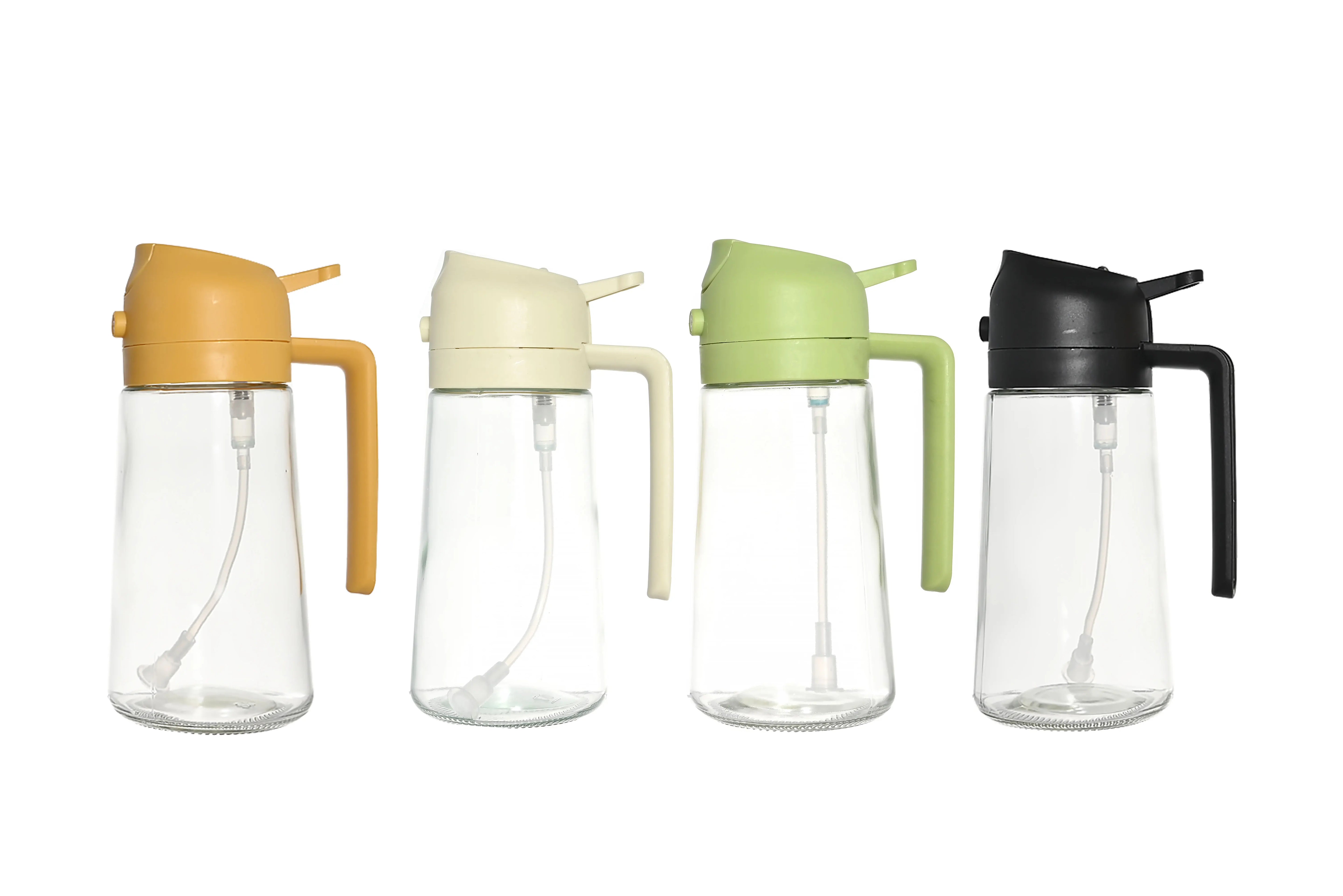 Glass Oil Spray Bottle set in four colors: green, cream, yellow, and black on a kitchen countertop.